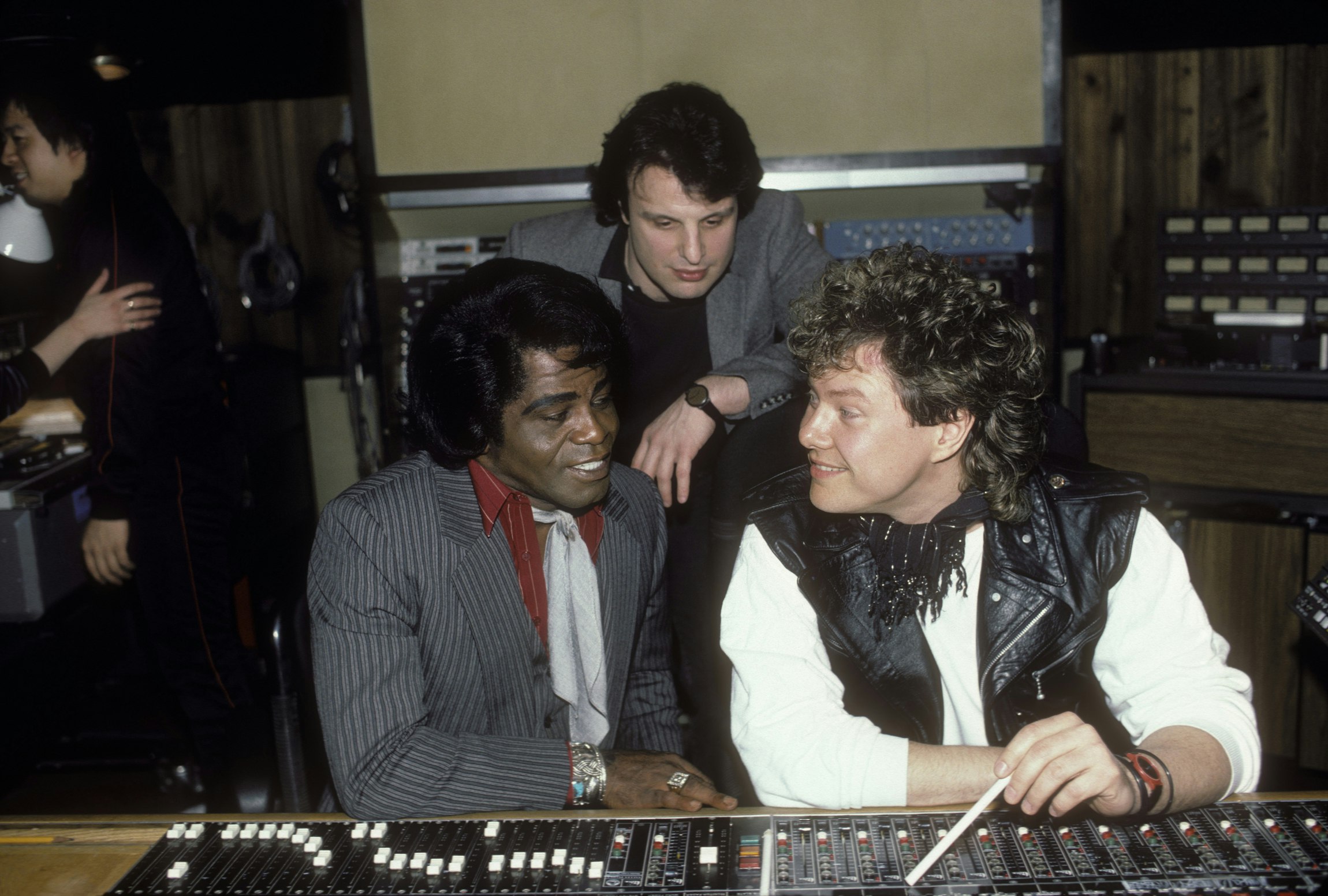 James Brown with producers Charlie Midnight and Dan Hartman in the control room at Greene Street Recording Studio, mixing Brown’s single “Living in America” for Rocky IV, circa 1985. Photo by Ebet Roberts/Redferns.